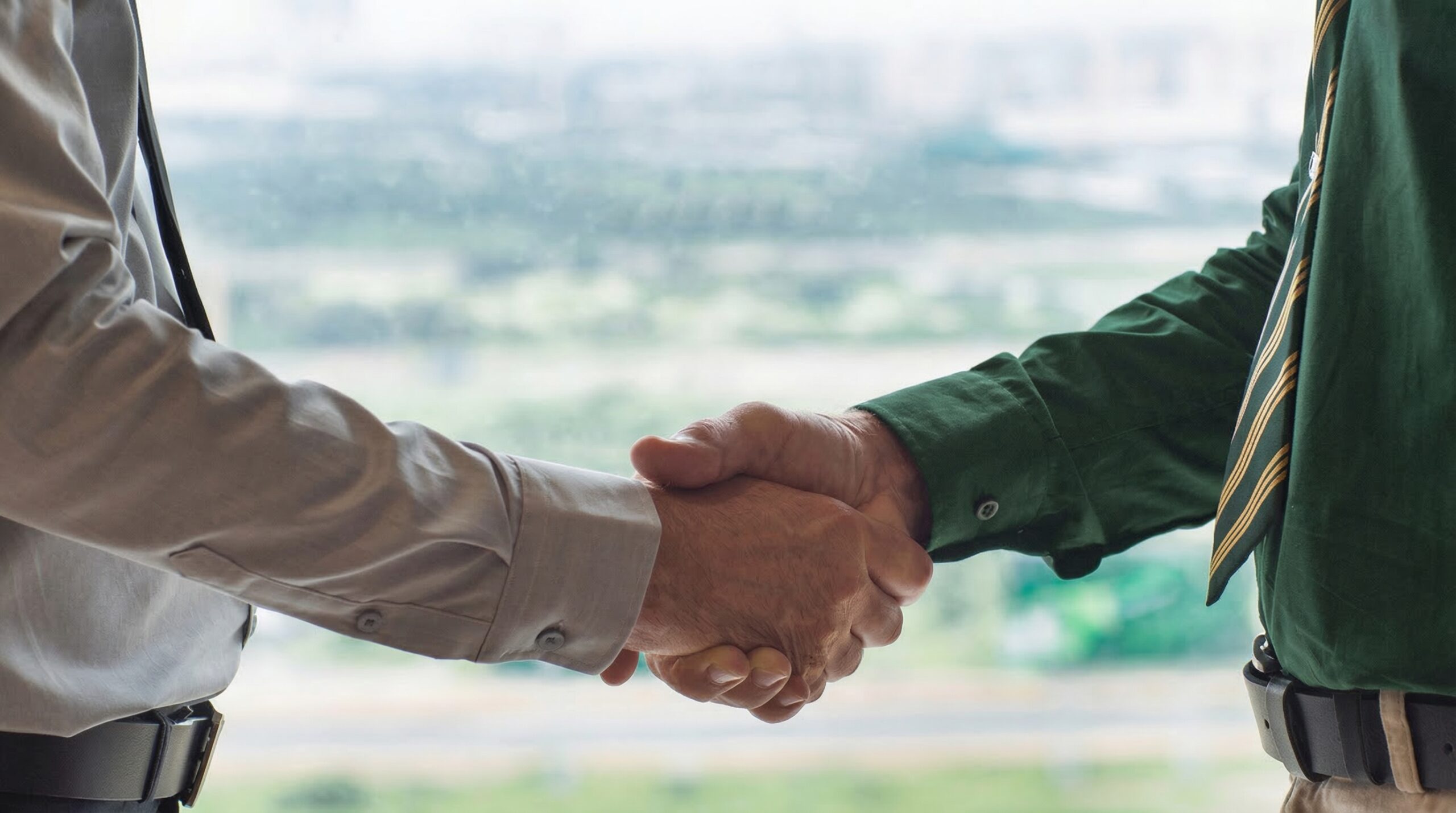 A close-up of a two person shaking hands