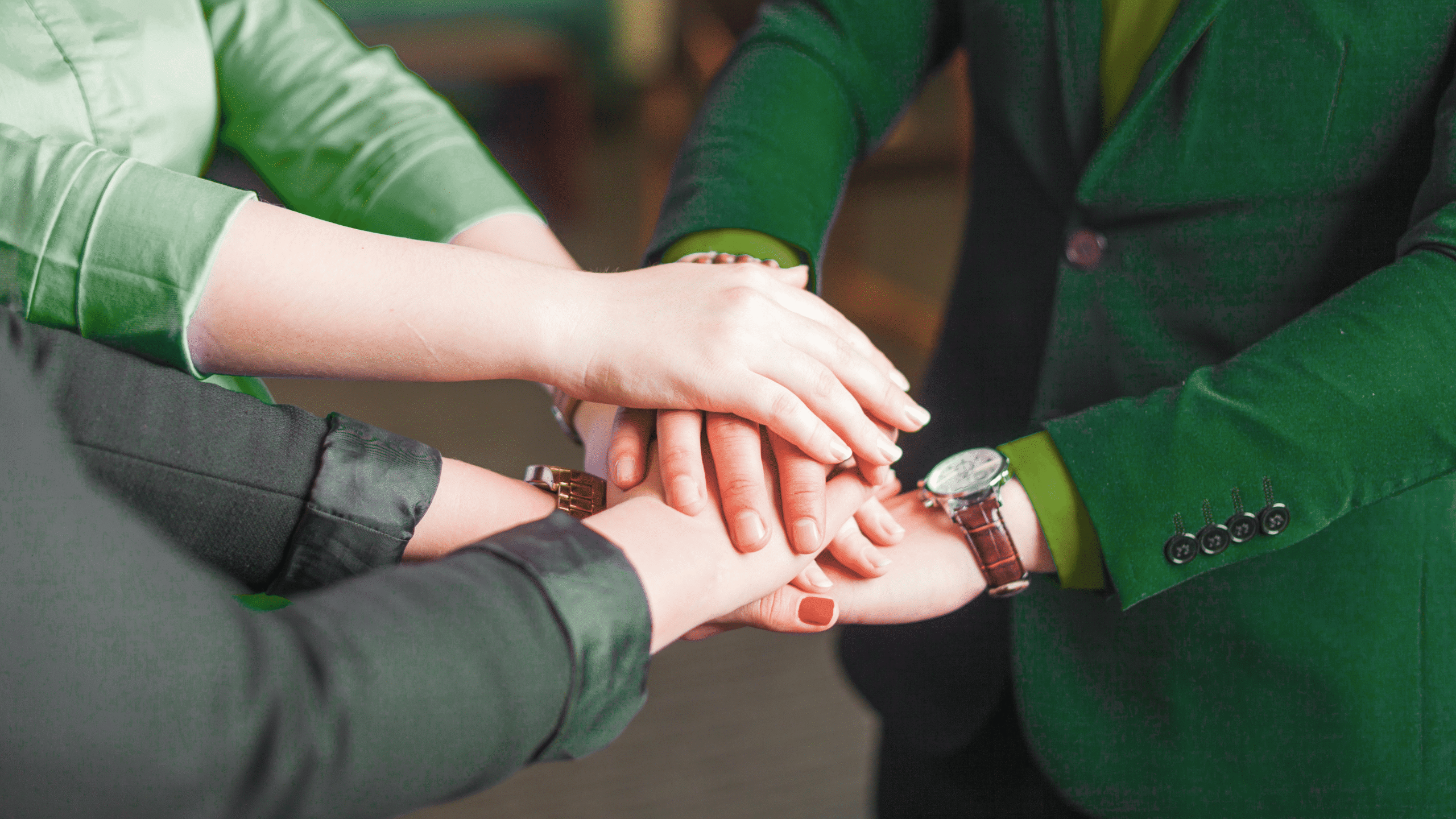 Business team stacking hands together, showing unity, collaboration, and shared commitment