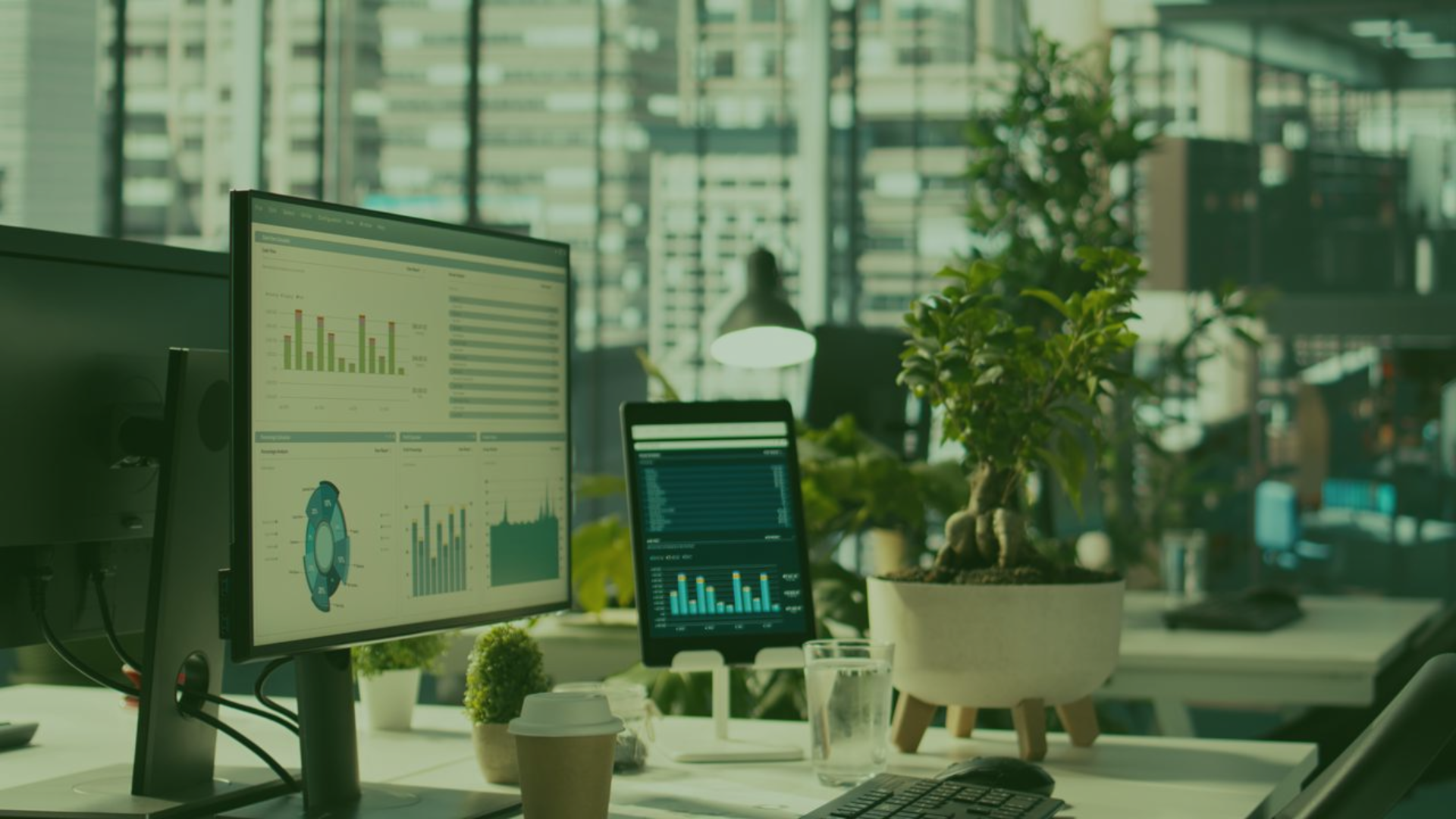 Business dashboard on office screens showing charts and reports, representing business visibility and data-driven operations.